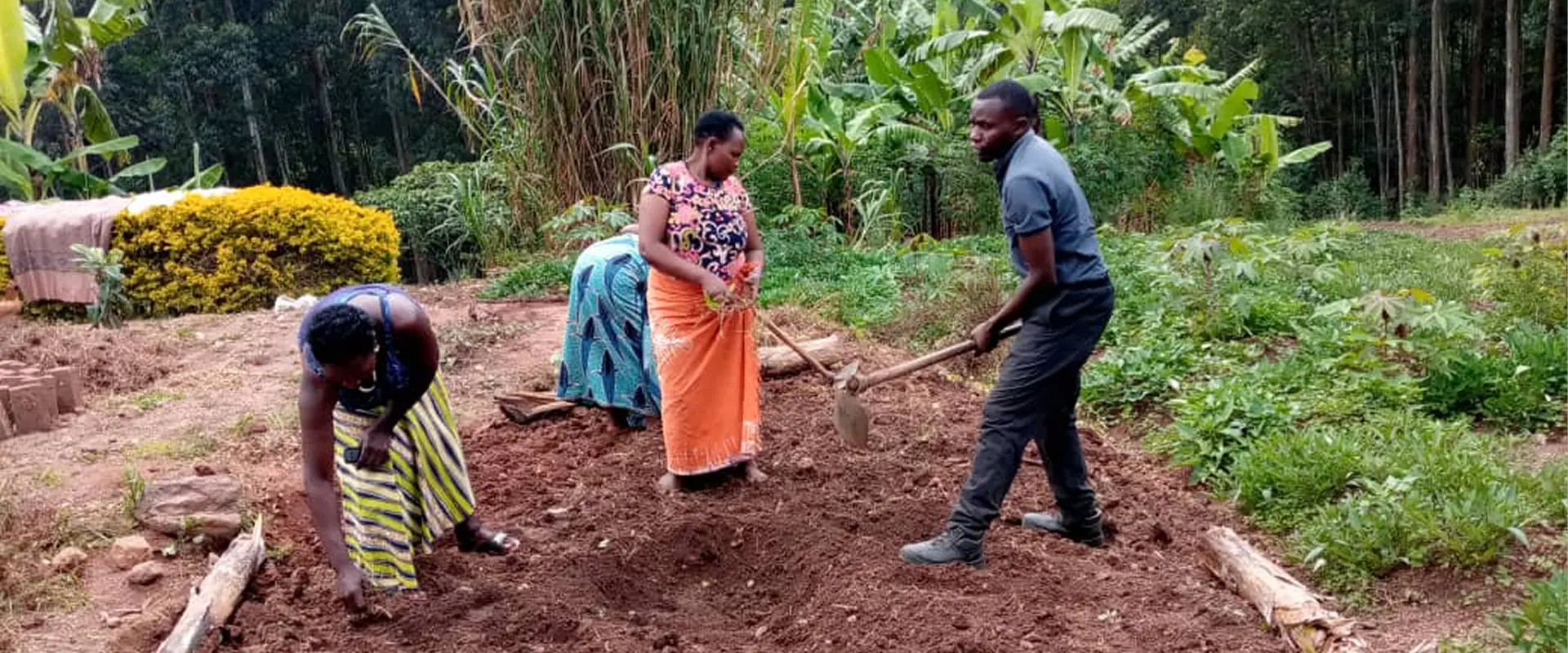 Community members preparing a garden plot together