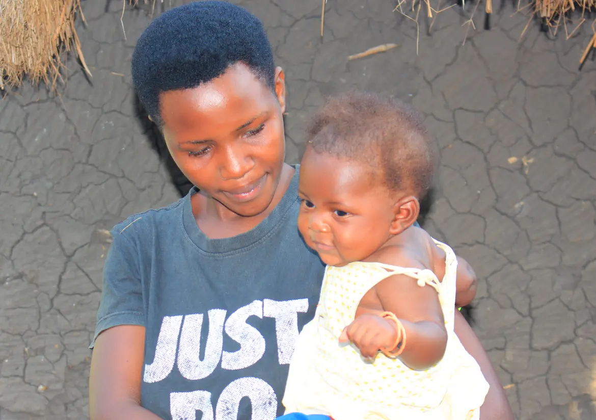A mother holding her baby