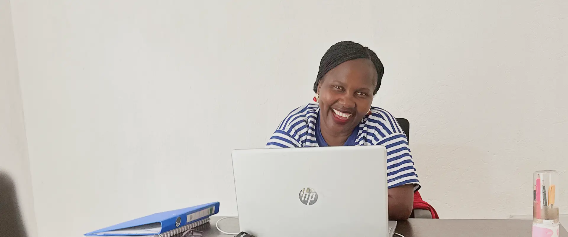 A woman working at a laptop