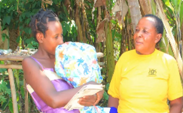 Community outreach worker with a young mother
